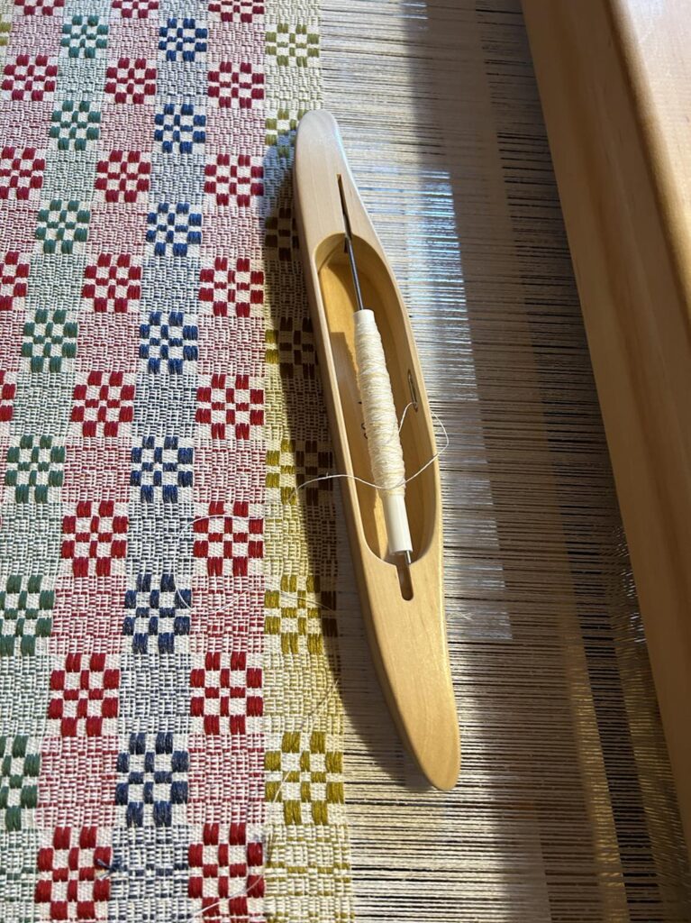 Tkanina wielonicielnicowa radziuszka, czułenko, warsztat tkacki